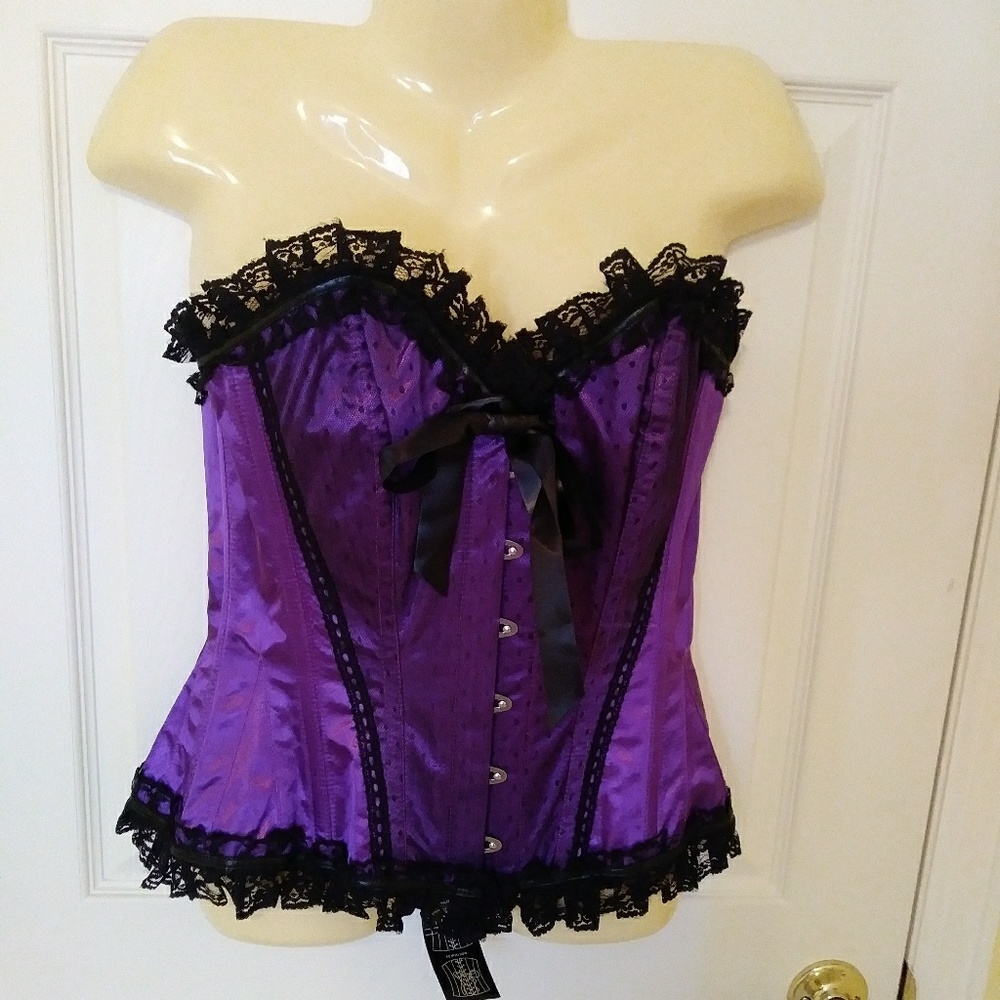 Purple satin corsett trimmed with black lace.
